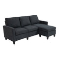 Canapé d'angle moderne en tissu gris anthracite avec repose-pieds.